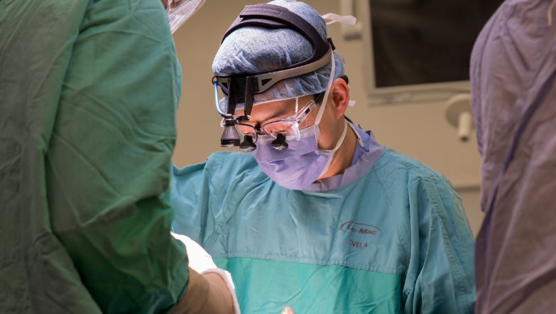 an orthopedic surgeon performing surgery