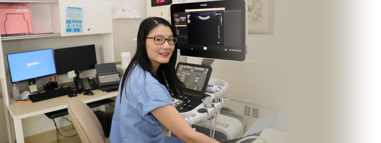 a doctor works with an ultrasound machine