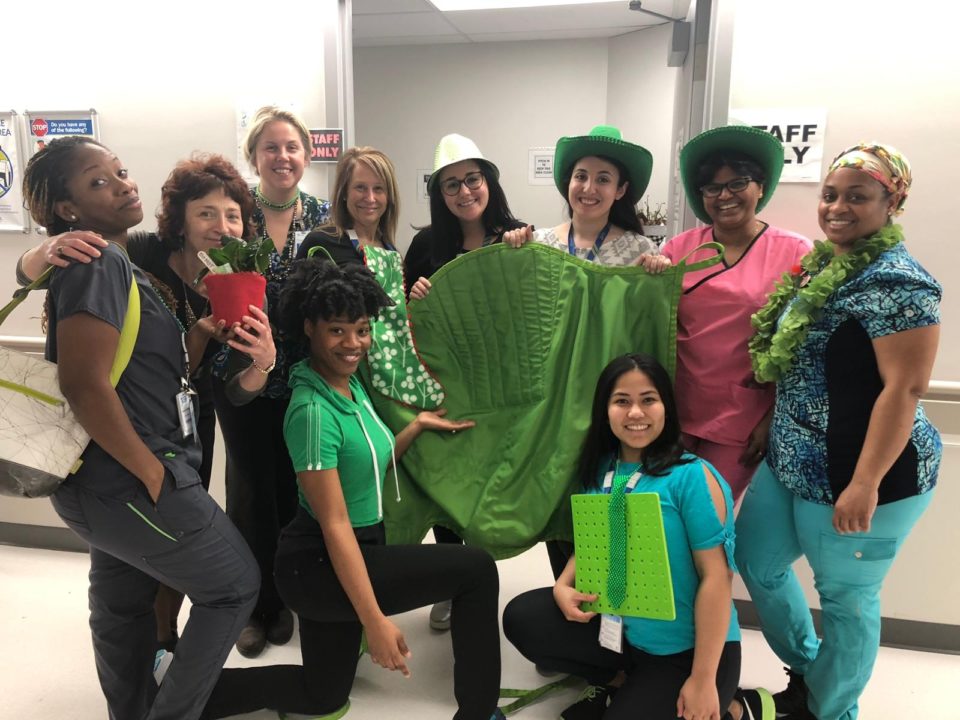 MSH nurses, dressed in green paraphernalia pose for a photo