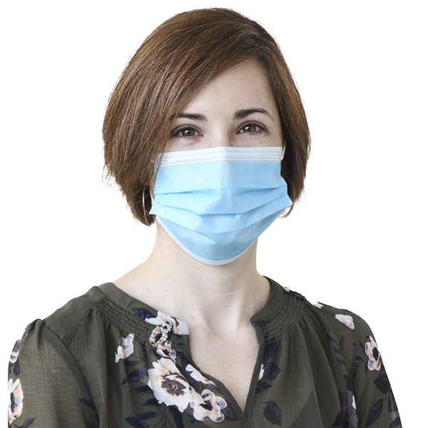 Lindsay Drysdale, seen from the chest up, wearing a green floral shirt, medical mask, and short brown hair