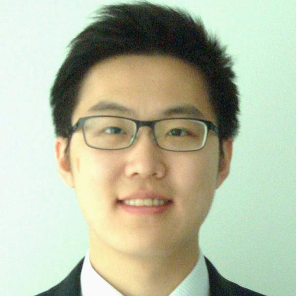 Dr. Peter Yang, seen from the neck up, wearing glasses and short black hair