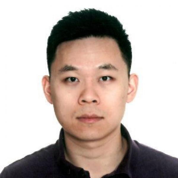 Dr. Fangzheng Yao, seen from the shoulders up, wearing a black shirt and short black hair