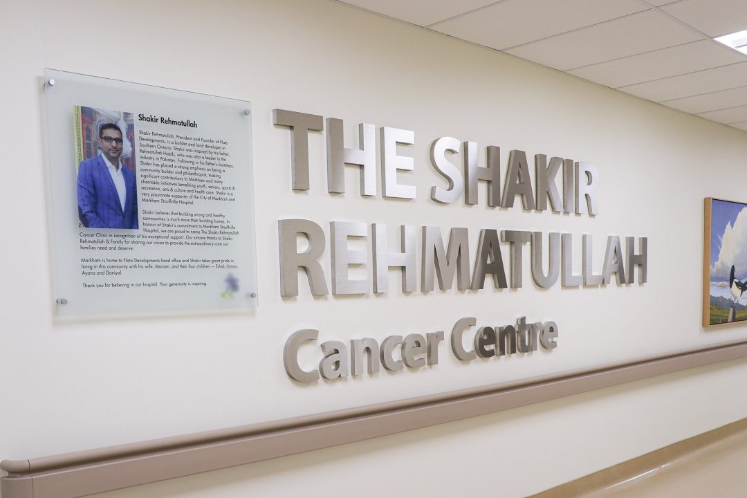 Large lettering on a wall inside the hospital spelling out the name of the cancer centre.