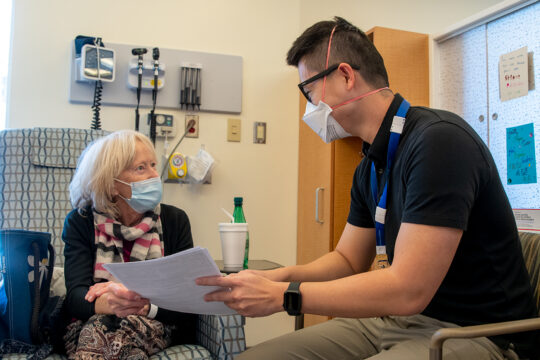 Oak Valley Health pharmacist counsels patient on medication protocol.