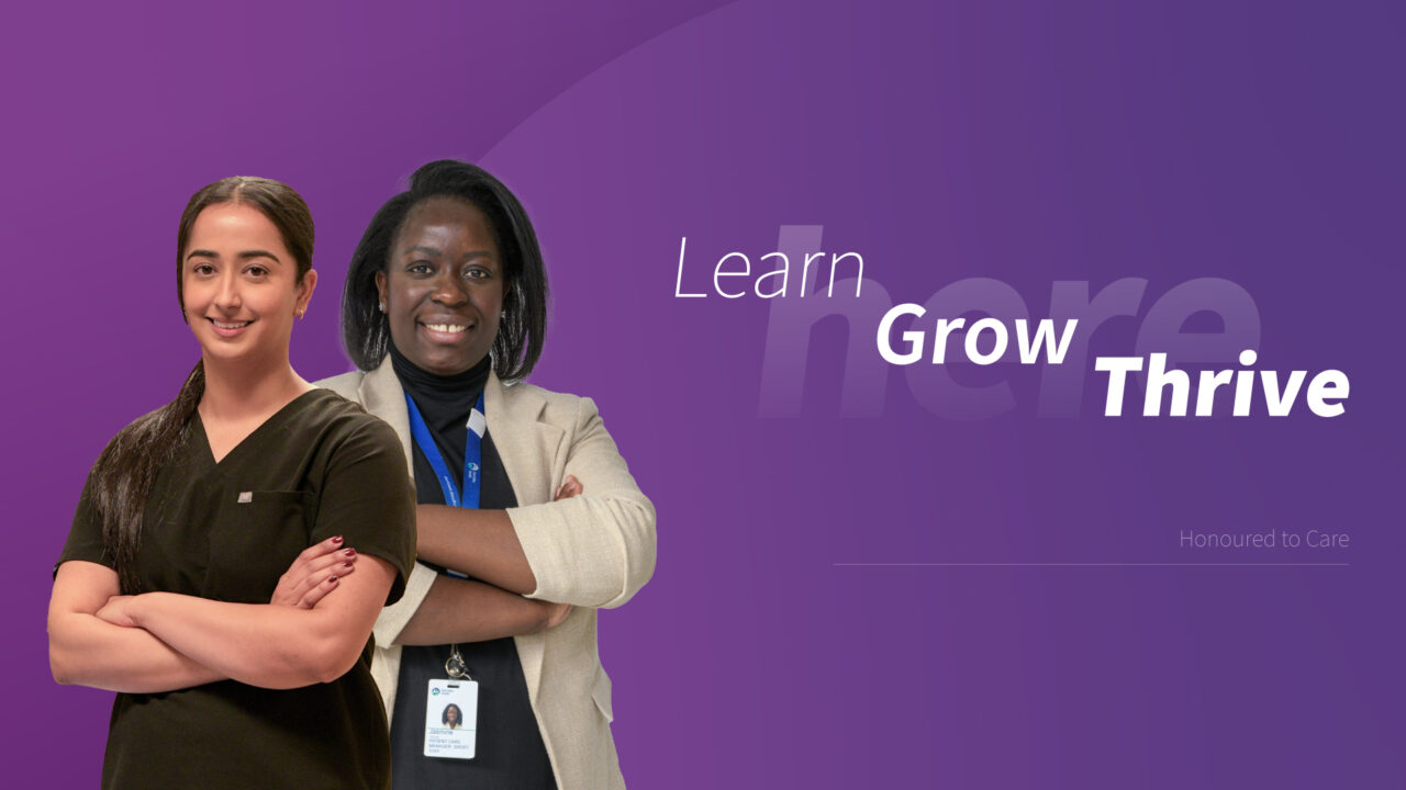 Two Oak Valley Health staff members standing beside each other with their arms crossed. Purple background. Text in the background that reads: Learn. Grow. Thrive.