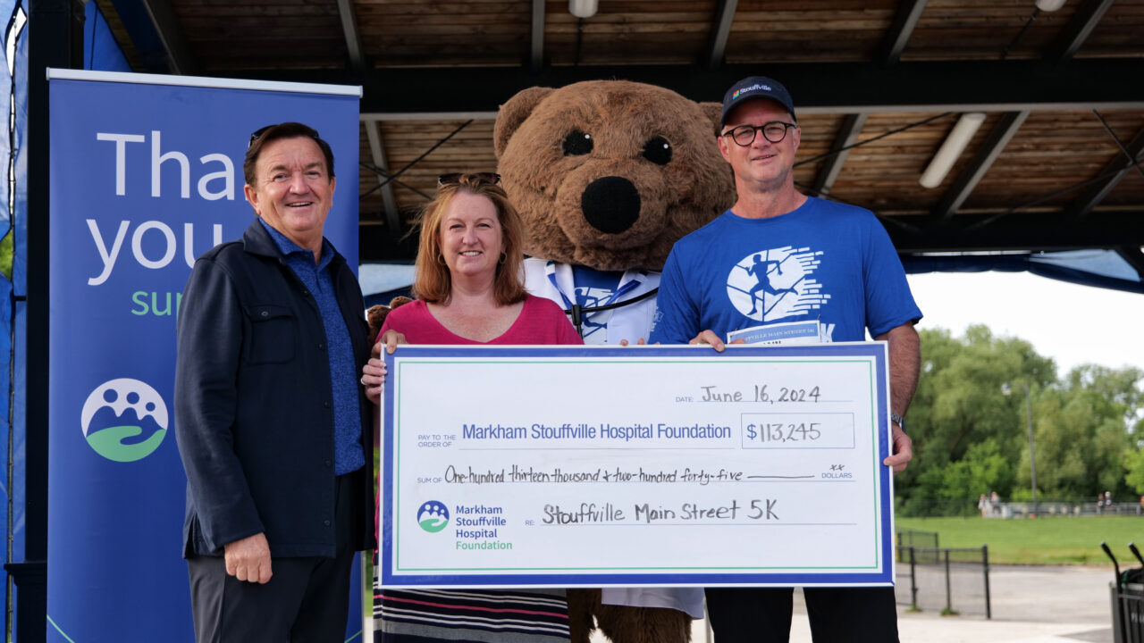 A cheque presentation at the Stouffville Main Street 5K